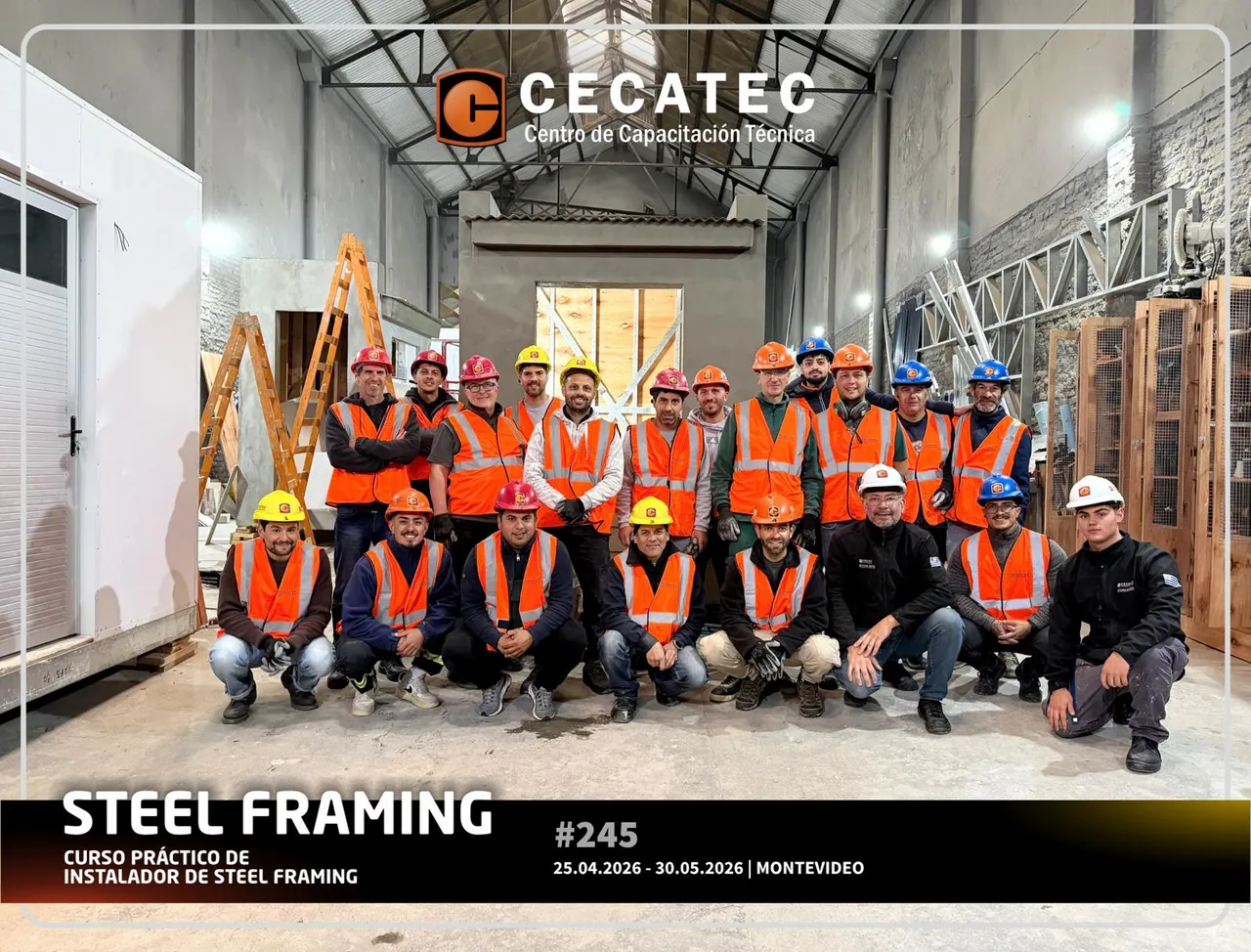 Group photo of the CECATEC steel framing installer course, cohort 245, in high-visibility vests and hard hats on the workshop floor in Montevideo.